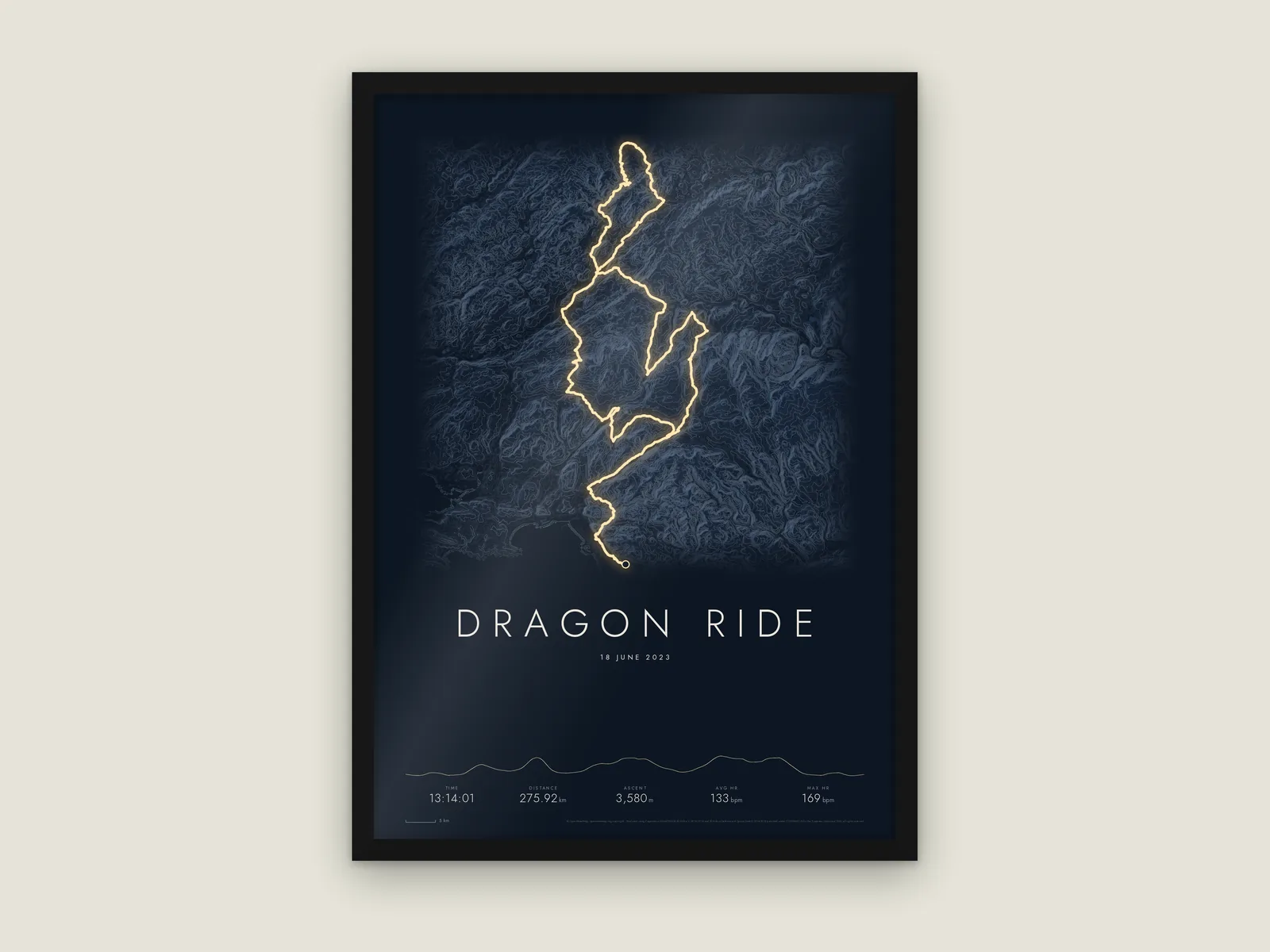 Digital preview of a Dragon Ride route print in a black frame, with a bright route over dark terrain and recorded activity statistics.